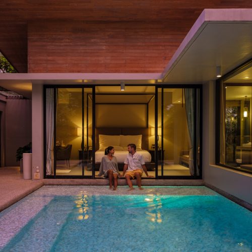 couple men and women on a luxury vacation at a pool villa