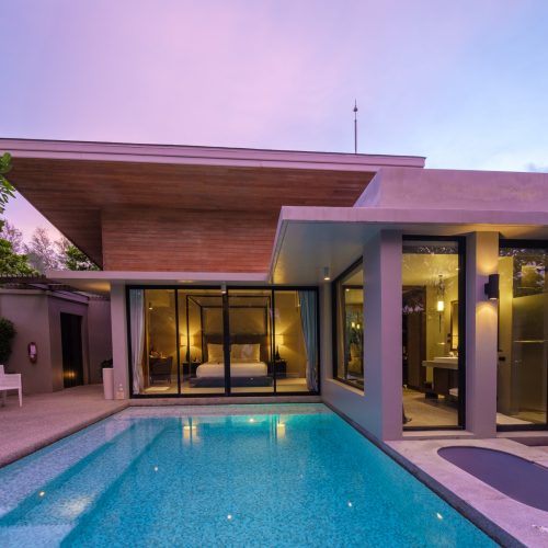 Modern house with a swimming pool, modern pool villa at the beach