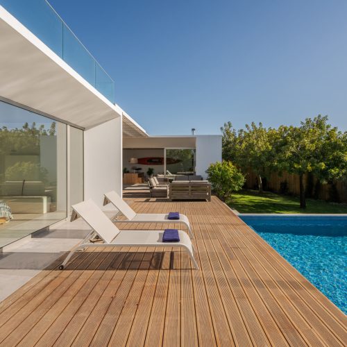 Modern villa with pool and deck with interior